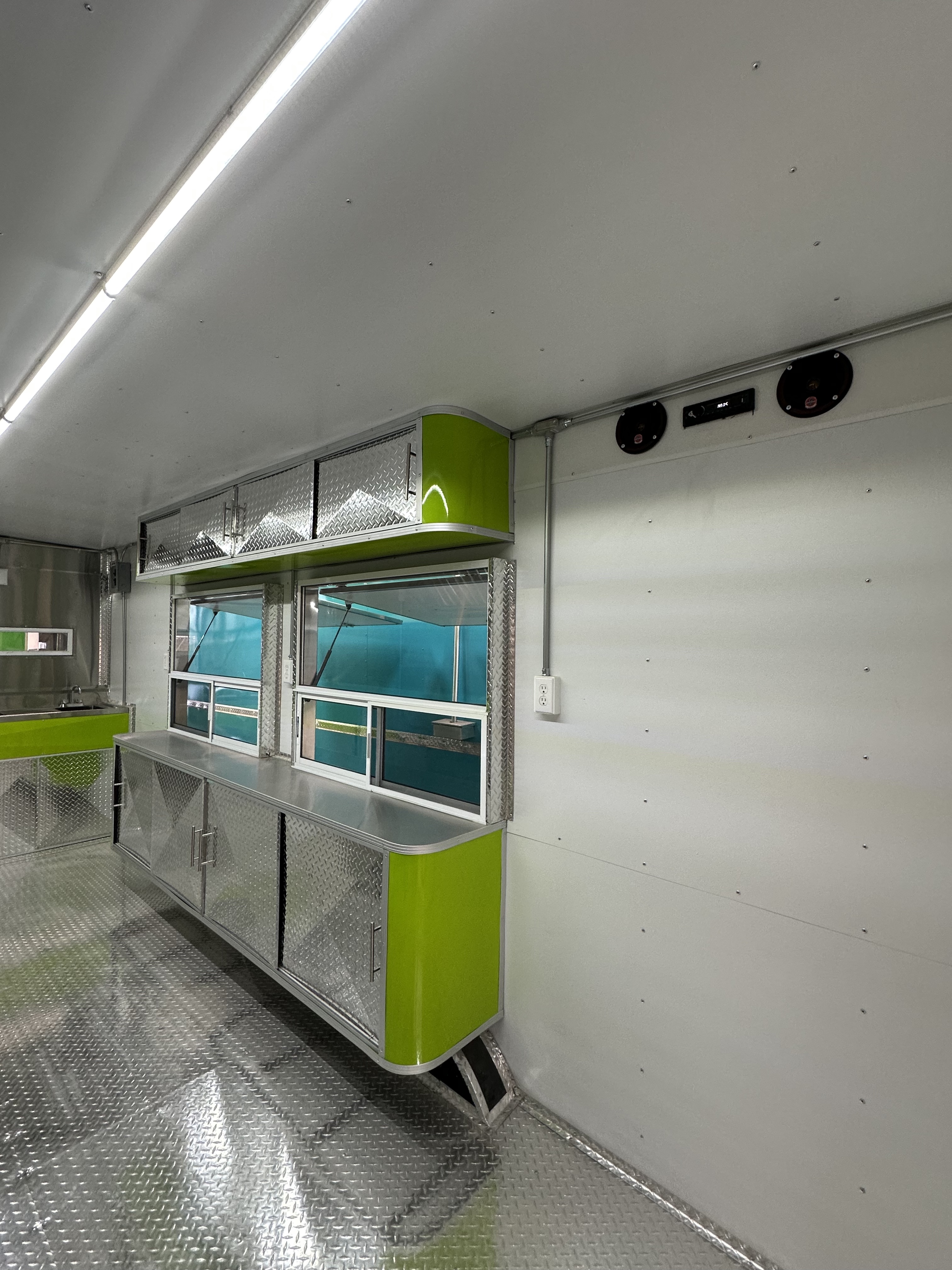 Premium LED-lit stainless steel kitchen workspace in trailer
