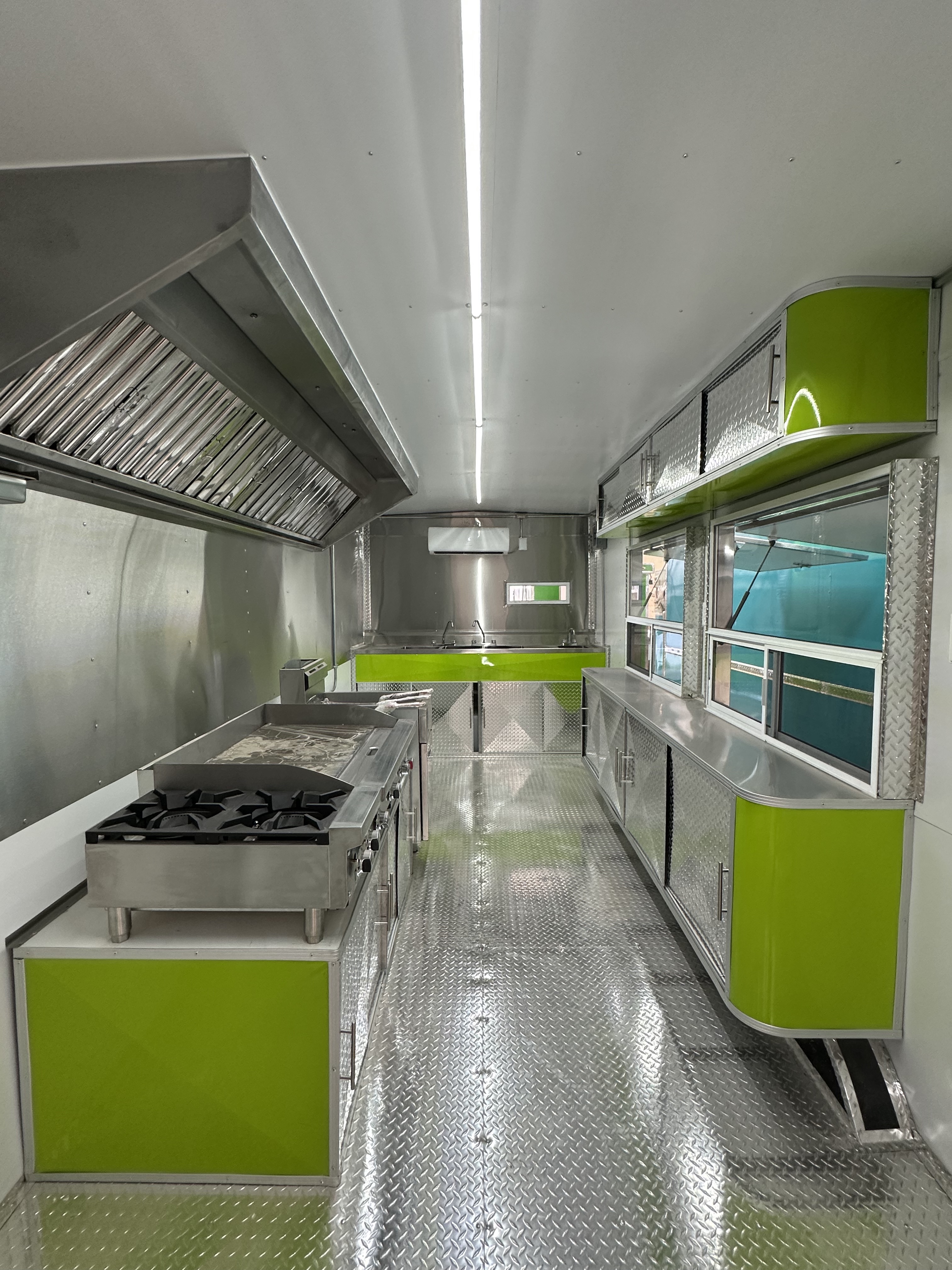 Close-up of stainless steel counters and commercial cooking equipment